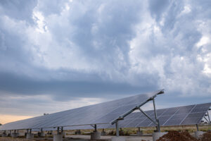 solar Panels outside with dark clouds in background